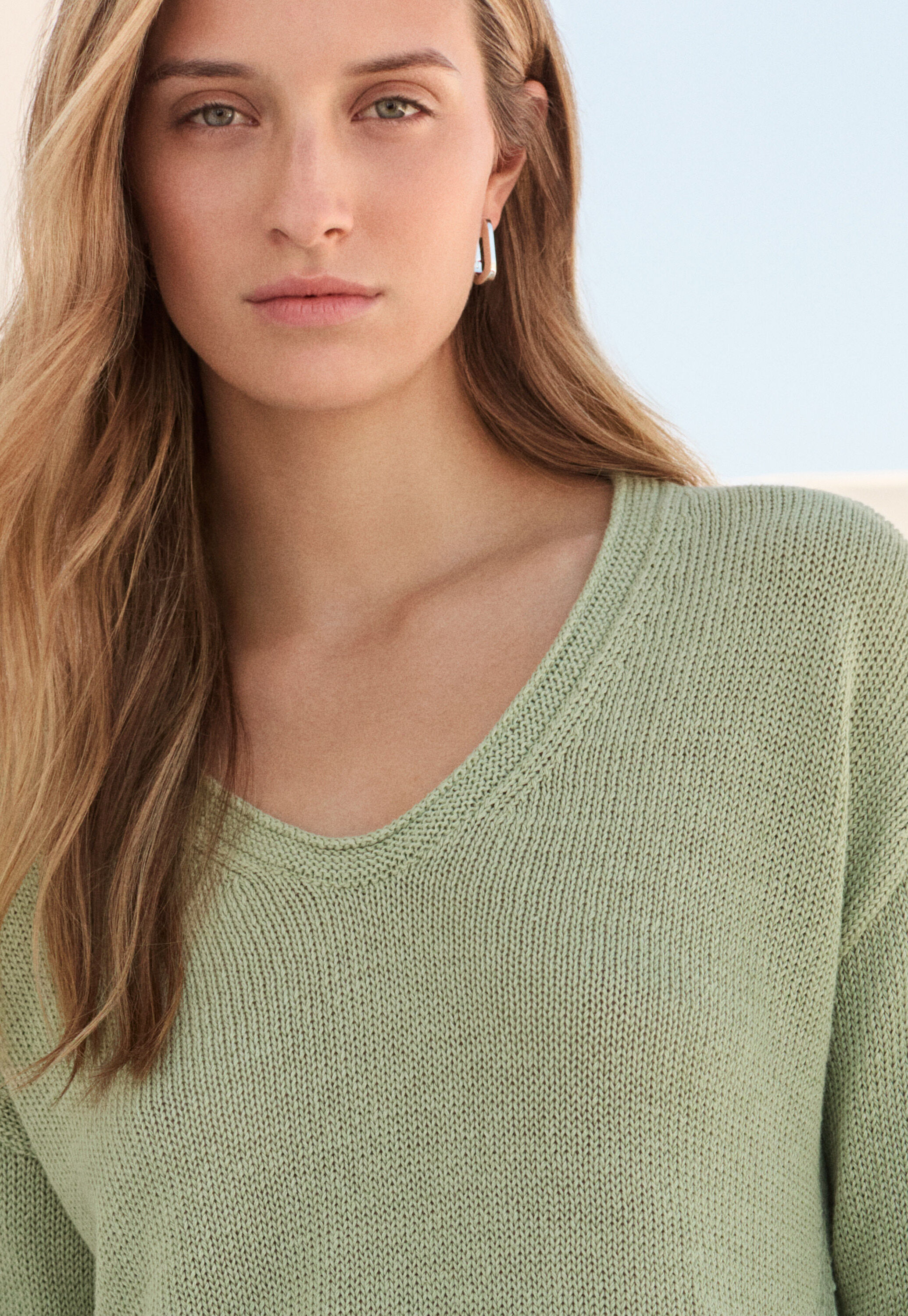 Curved v-neck sweater