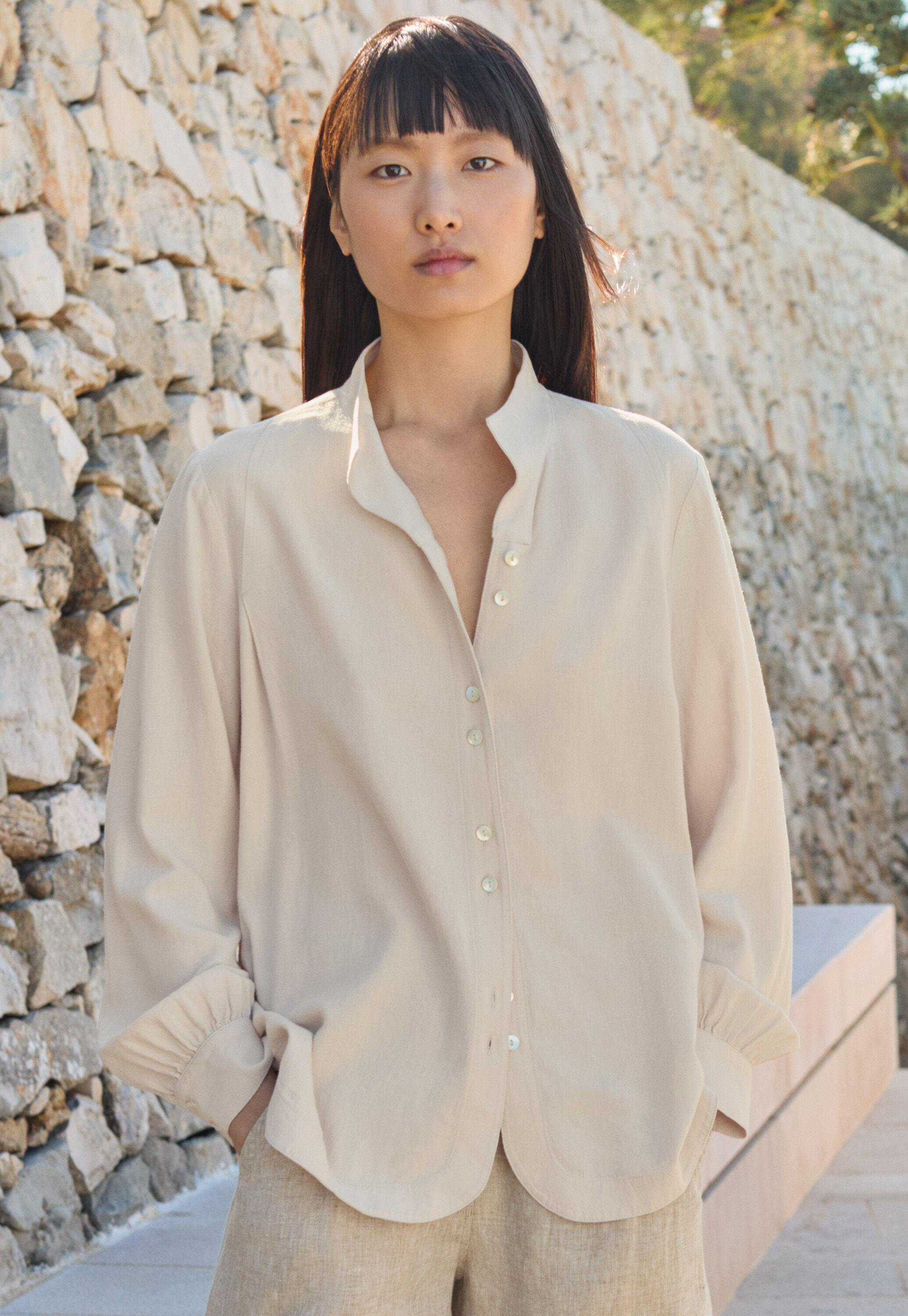 Curved-sleeve blouse